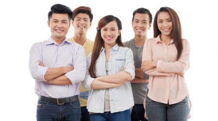 Happy business team Cheerful young Vietnamese business team on white background
